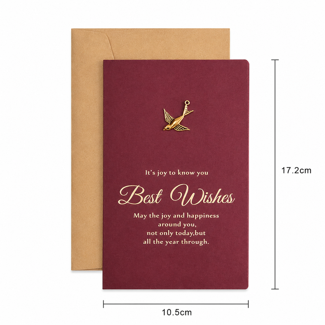 Maroon card with gold text and bird illustration, accompanied by a brown envelope, on a white background.
